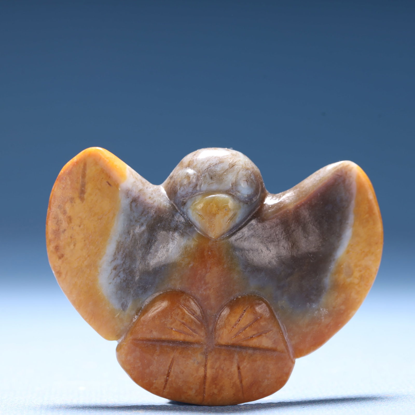 An Archaic Hongshan Culture Yellow Jade Bird Ornament: An Archaic Hongshan Culture Yellow Jade Bird Ornament,Ancient Time,China,Size:2.3inx0.6inx1.7in,Weight:40.6g 红山文化黄玉鸟摆件,中国&#