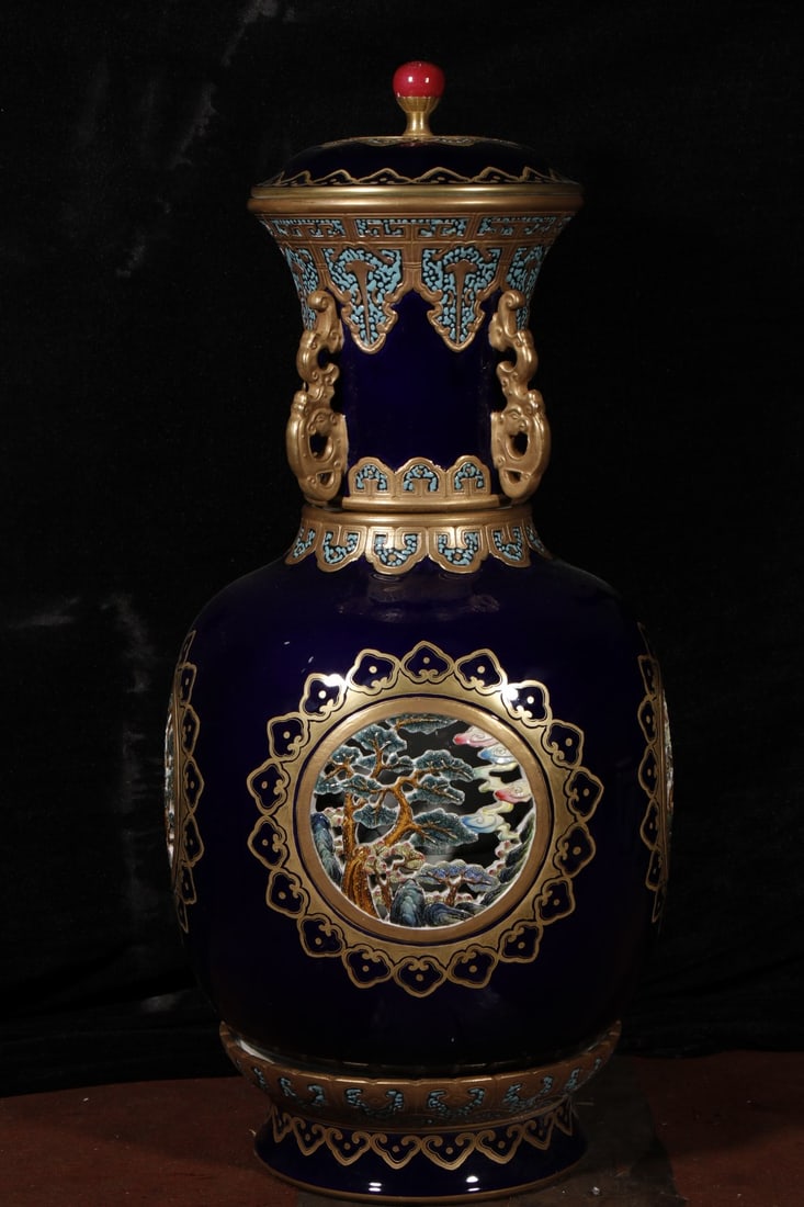 An Exquisite Ji Blue Glazed Hollow Landscape Pattern Bottle: An Exquisite Ji Blue Glazed Hollow Landscape Pattern Bottle,Qing Dynasty,China,Qianlong Four-character Mark,Size:31.5inx9.8in 
