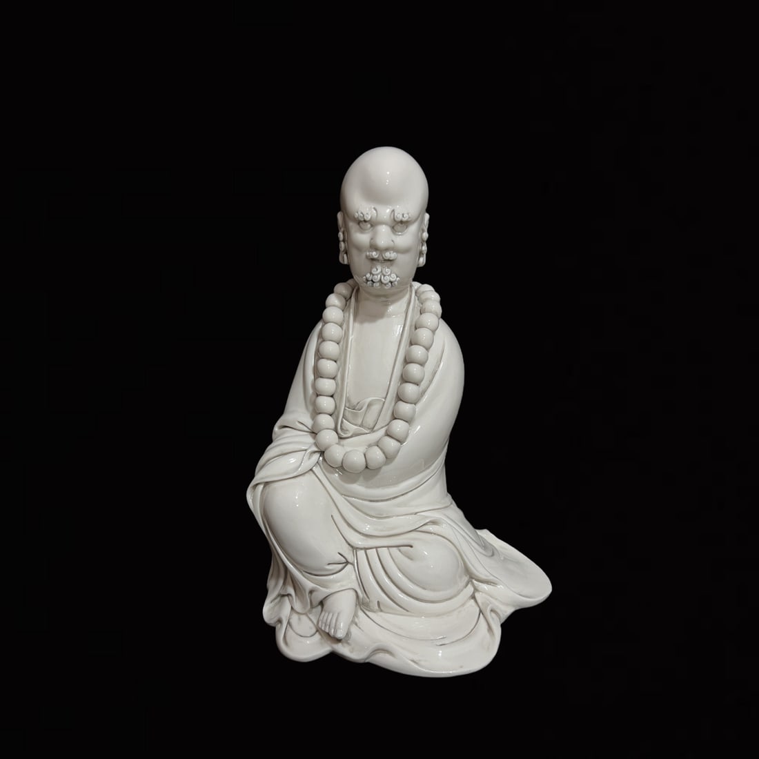 A Solemn Blance-De-Chine Statue of Dharma (1 of 8)