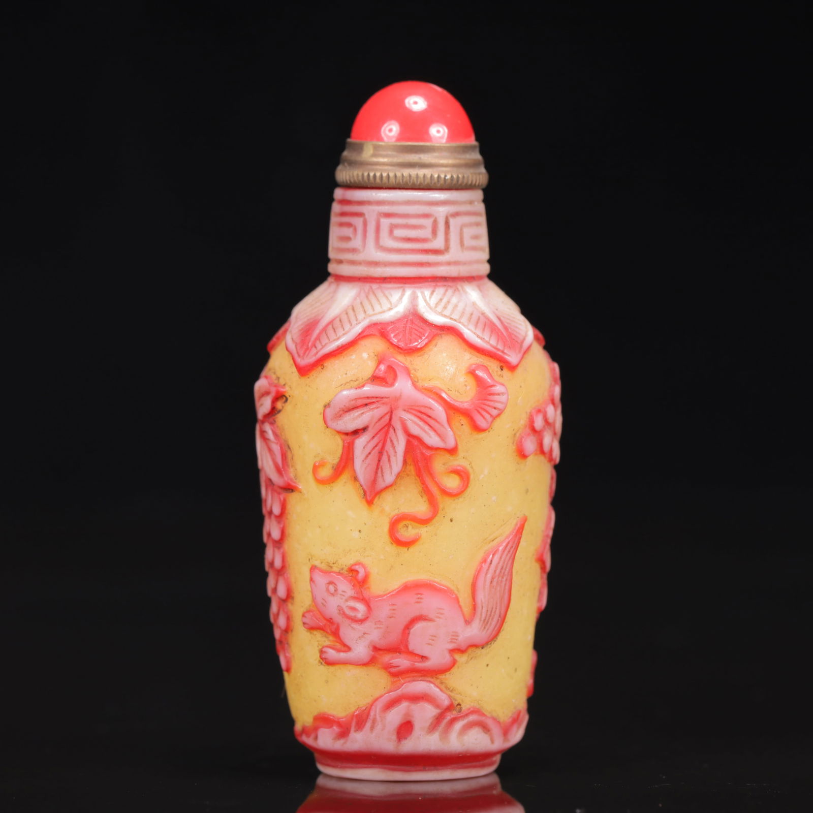 An Exquisite Glass Squirrel and Grapes Pattern Snuff Bottle: An Exquisite Glass Squirrel and Grapes Pattern Snuff Bottle,Qing Dynasty, China,Size:1.4inx3.1in, Weight:56g 琉璃葡萄松鼠纹鼻烟壶,中&#