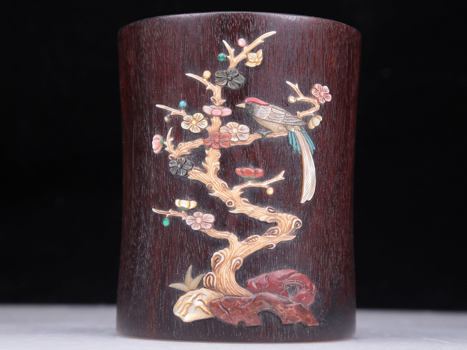 A Precious Zitanwood Gem-Inlaid 'Bird& Flower' Brush Pot: A Precious Zitanwood Gem-Inlaid 'Bird& Flower' Brush Pot. The exterior is inlaid in polychrome with flowers and birds with detailed, fine feather markings. Chinese Qing Dynasty. Size:3.9inx4.6in.
