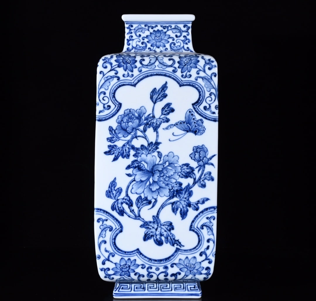 An Exquisite Blue and White Flower and Butterfly Pattern Vase: An Exquisite Blue and White Flower and Butterfly Pattern Vase,Qing Dynasty,China,Qianlong Six-character Mark,Size:12.2inx5.1in 青花花卉蝴蝶纹瓶,中