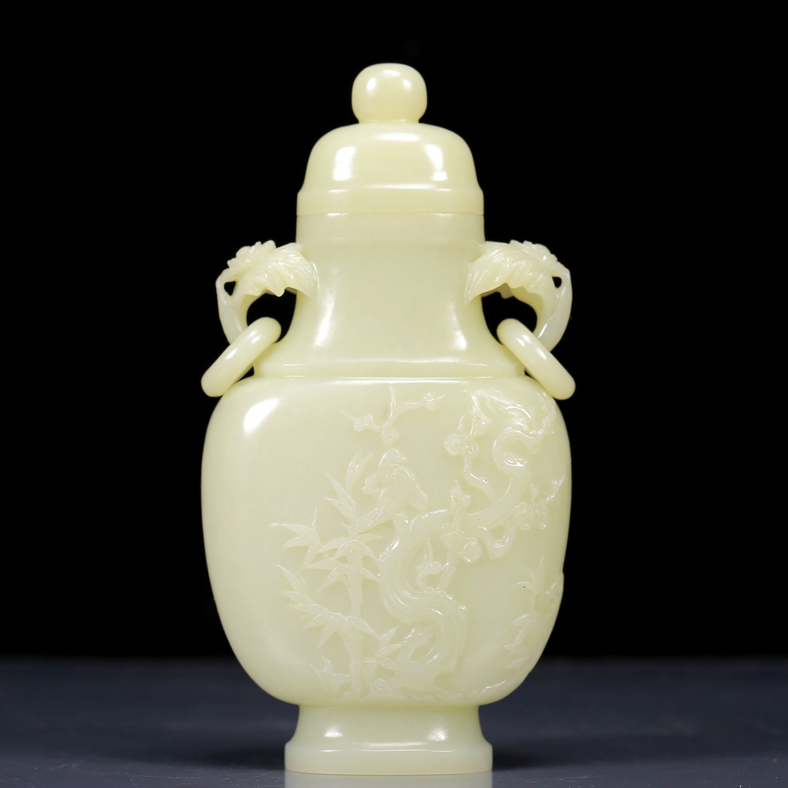 An Exquisite White Jade Flower Pattern Double-Ears Bottle: An Exquisite White Jade Flower Pattern Double-Ears Bottle,Qing Dynasty, China,Size:3.9inx1.6inx7.5in,Weight:415g 白玉花卉纹双耳瓶带盖，
