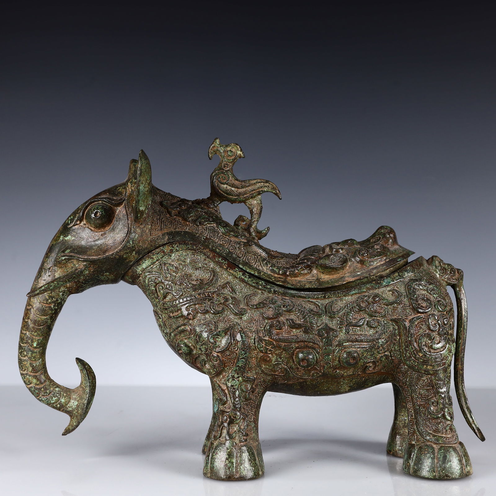 A Rare Bronze Elephant Cup: A Rare Bronze Elephant Cup,Shang and Zhou Dynasty, China,Size:13.4inx9.4inx6.3in,Weight:4300g 青铜象杯,中国商周时期