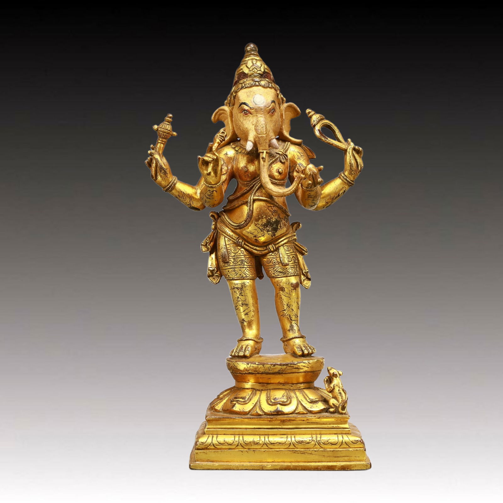 A Solemn Gilt Bronze Statue of Ganesh: A Solemn Gilt Bronze Statue of Ganesh,Ming Dynasty, China,Size:4.7inx2.8inx9.1in,Weight:1200g 铜鎏金象鼻财神像,中国明代
