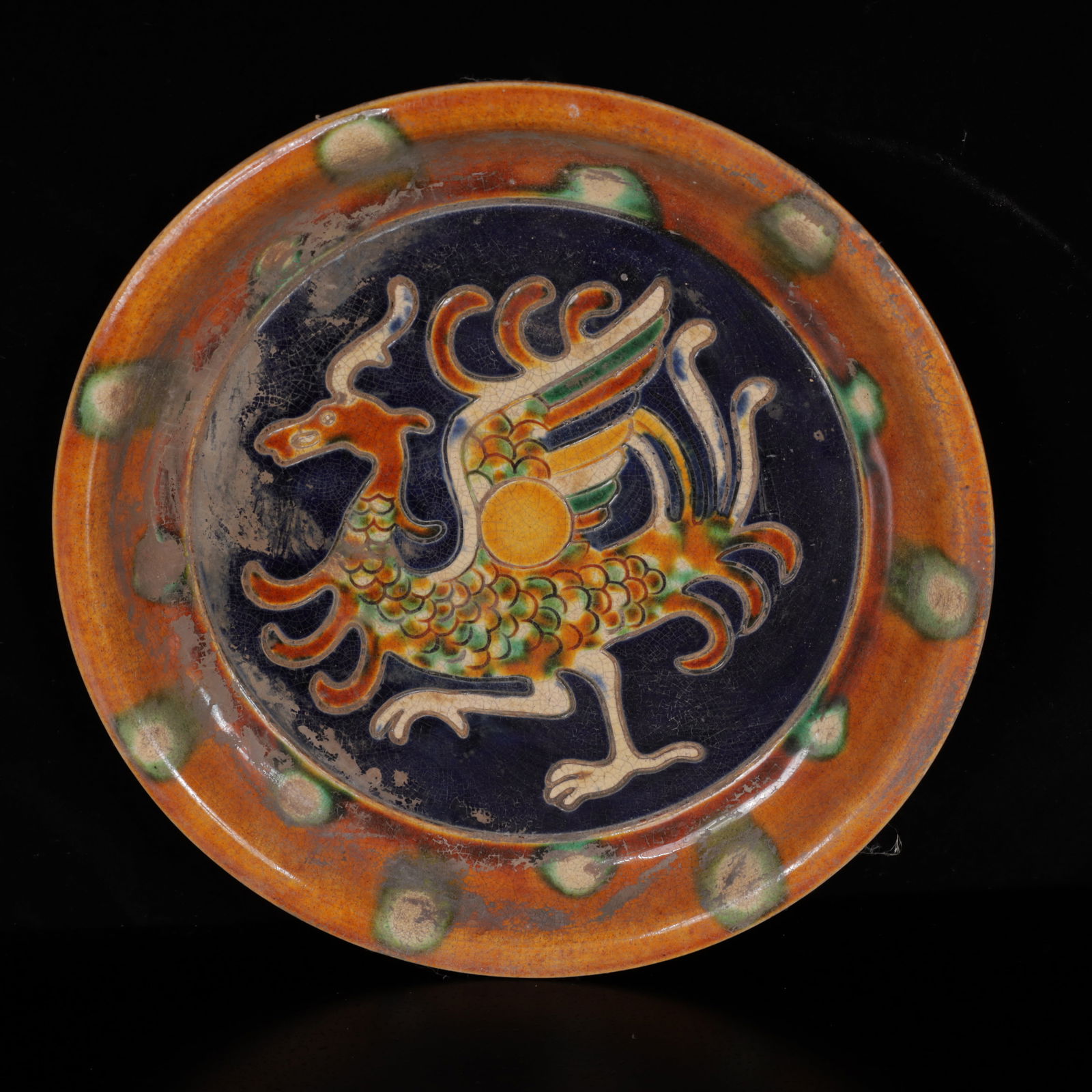 An Exquisite Tang Tri-Color Glazed Pottery Auspicious Beast Plate: An Exquisite Tang Tri-Color Glazed Pottery Auspicious Beast Plate,Tang Dynasty,China,Size:8.7inx8.7inx1.2in,Weight:500g 