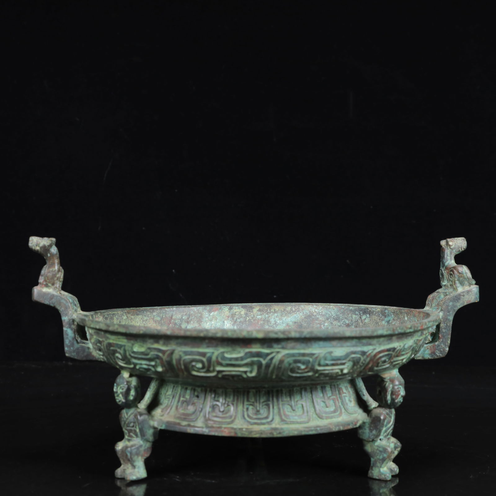 An Archaic Bronze Double-Ears Figure Plate,with Inscription: An Archaic Bronze Double-Ears Figure Plate,with Inscription,the Warring States Period in China,Size:9.4inx7.9inx4.7in,Weight:1600g 青铜双耳人物盘,带&