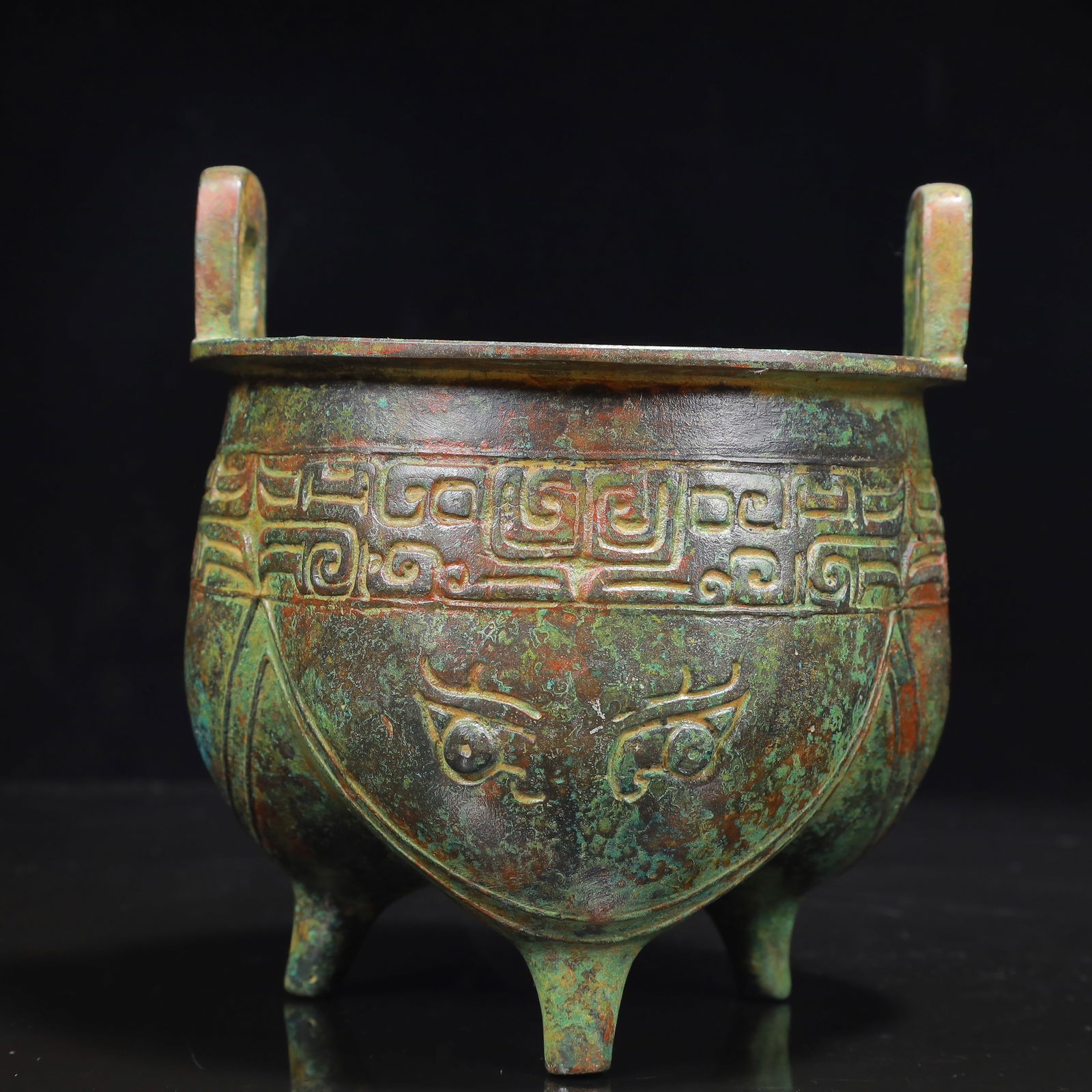 An Archaic Bronze Beast-Face Pattern Double-Ears and Tripod Censer: An Archaic Bronze Beast-Face Pattern Double-Ears and Tripod Censer,the Warring States Period in China,Size:6.1inx6.3inx7.1in,Weight:1650g 青铜兽面纹双耳ߍ
