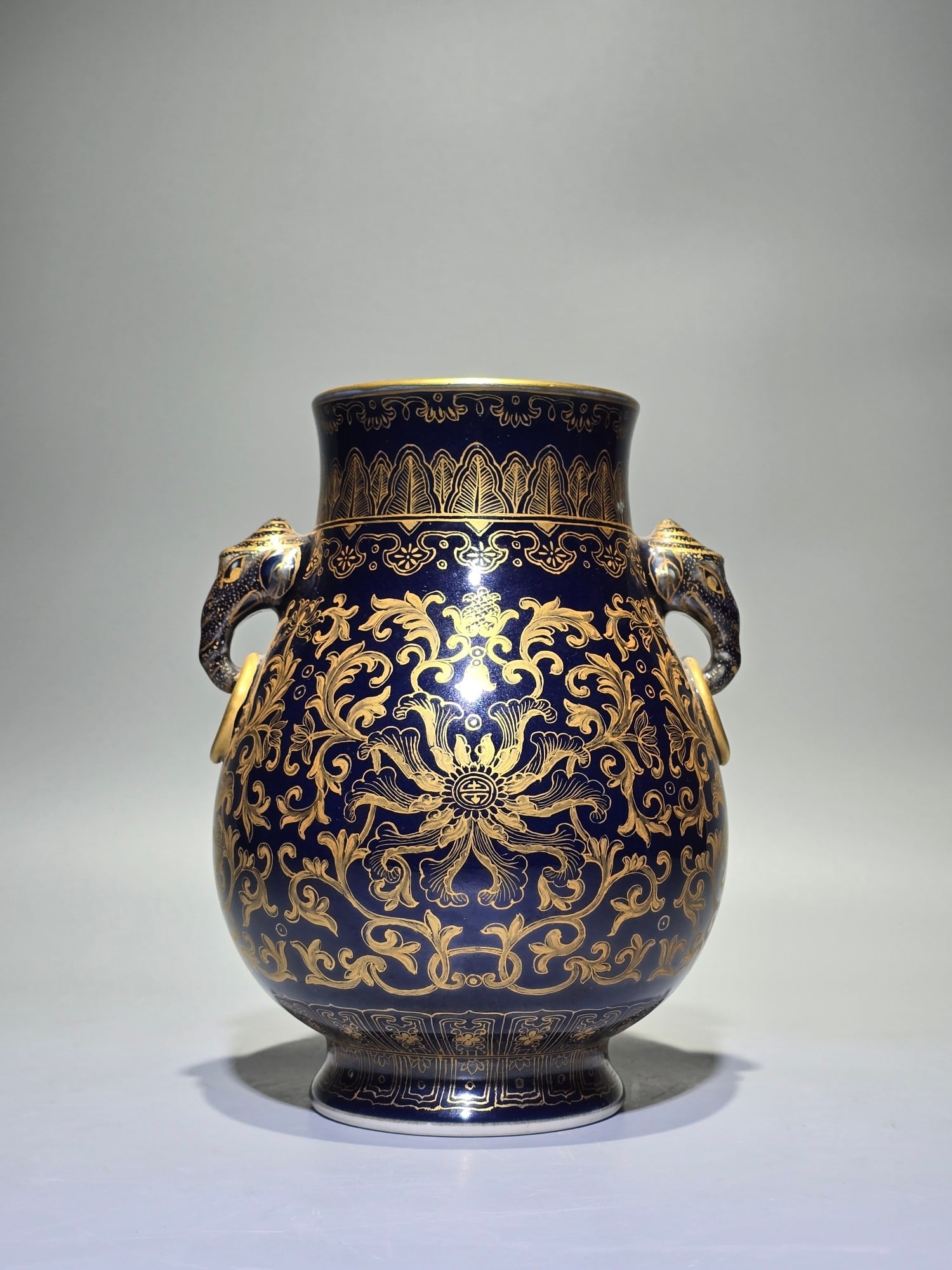 An Exquisite Ji Blue Glazed Painted Gold Lotus Pattern Elephant-Ears Vase: An Exquisite Ji Blue Glazed Painted Gold Lotus Pattern Elephant-Ears Vase,Qing Dynasty,China,Qianlong Six-character Mark,Size:7.3inx5.4in 霁蓝釉描金缠枝ഫ