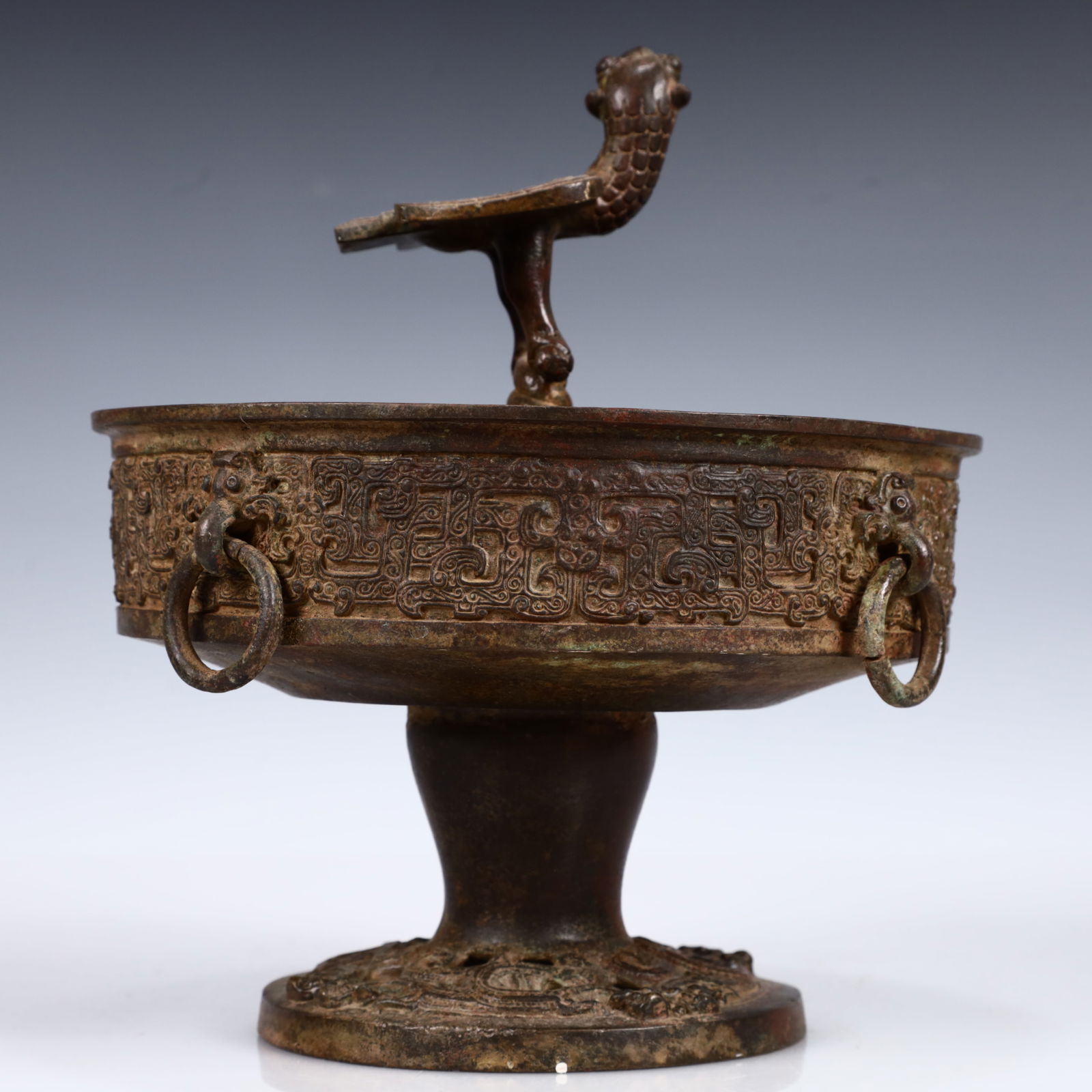 A Rare Bronze Phoenix Plate: A Rare Bronze Phoenix Plate,the Warring States period in China,Size:7.9inx9.1in,Weight:2350g 青铜凤鸟盘,中国战国时期