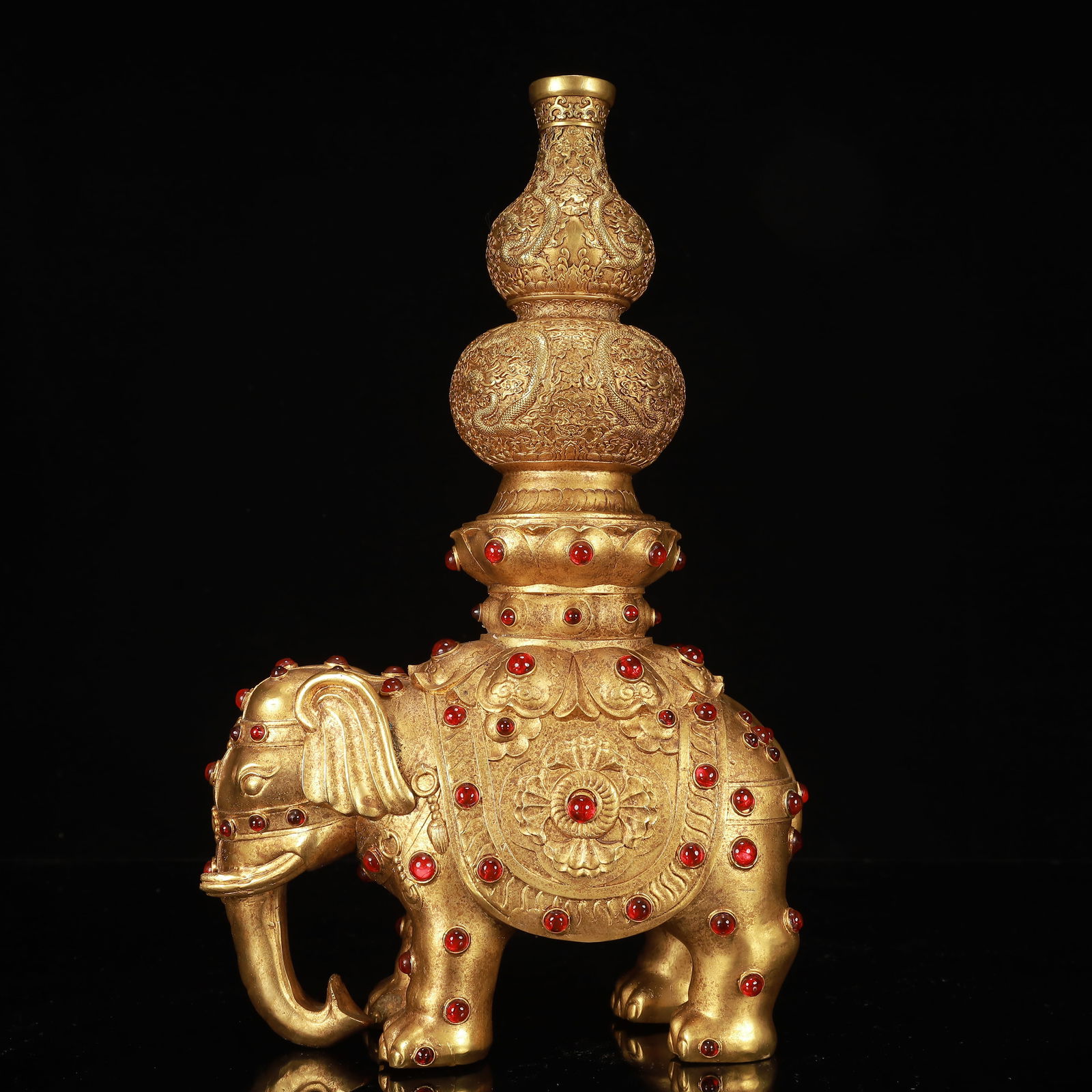 A Rare Gilt Bronze Dragon Pattern Elephant Ornament,Inlaid Gems: A Rare Gilt Bronze Dragon Pattern Elephant Ornament,Inlaid Gems,Qing Dynasty, China,Qianlong Four-character Mark,Size:9.4inx4.7inx15in,Weight:3050g 