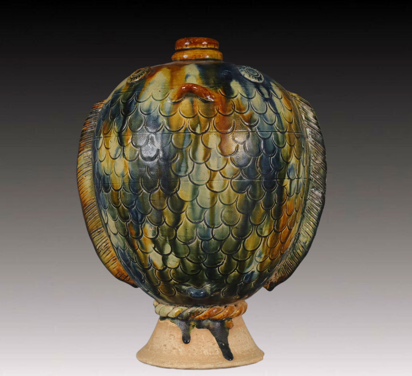 An Exquisite Tang Tri-Color Glazed Pottery Fish-Shaped Vase: An Exquisite Tang Tri-Color Glazed Pottery Fish-Shaped Vase,Tang Dynasty, China,Size:6.7inx7.9inx10.2in,Weight:1800g 