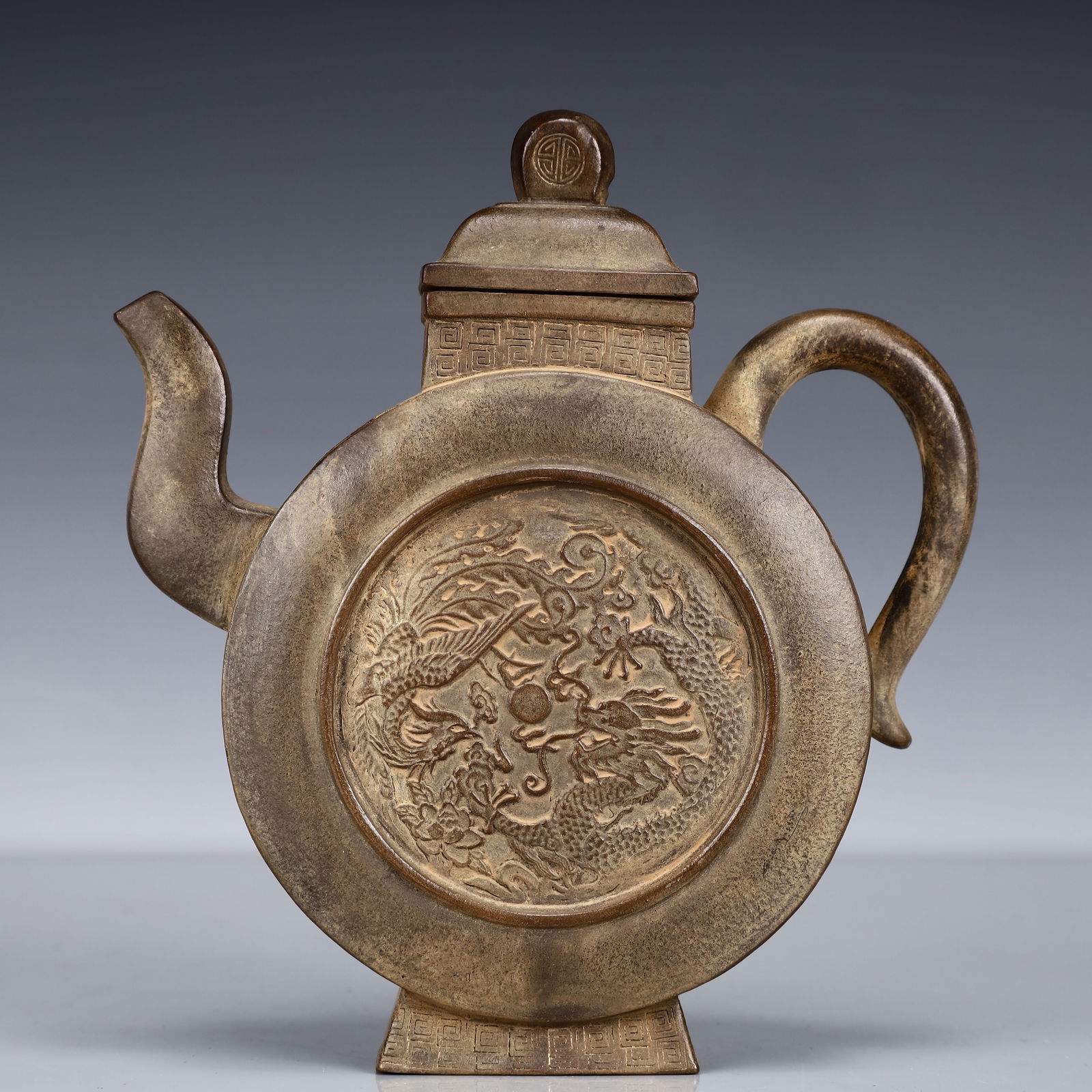 An Exquisite Purple Sands Dragon and Phoenix Pattern Teapot: An Exquisite Purple Sands Dragon and Phoenix Pattern Teapot,Qing Dynasty, China,Qianlong Six-character Mark,Size:6.3inx2inx7.1in,Weight:450g 紫砂龙凤纹茶壶,&#