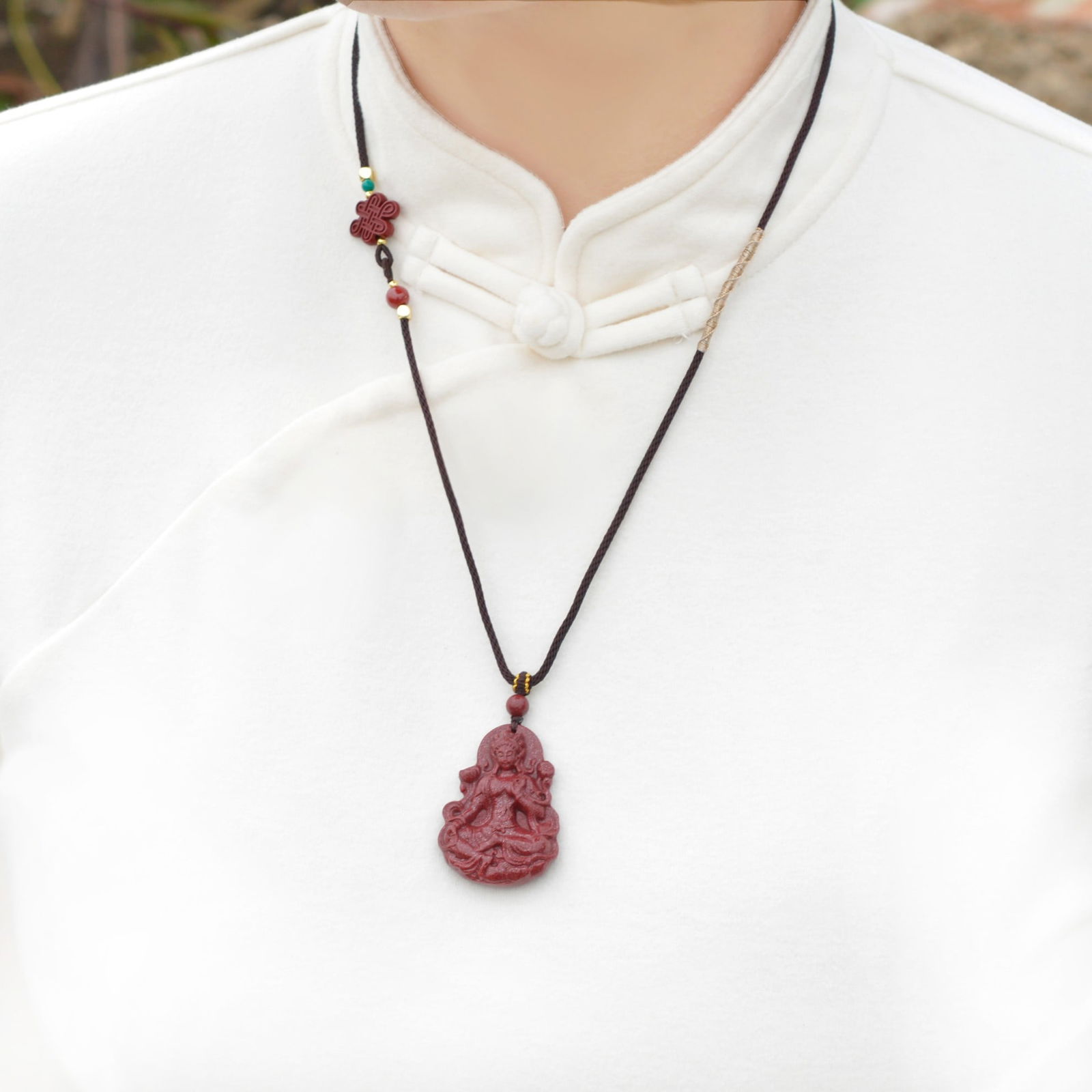 An Exquisite Cinnabar Pendant with Statue of Avalokitesvara: An Exquisite Cinnabar Pendant with Statue of Avalokitesvara,Size:0.8inx1.7in,Weight:22.5g 朱砂挂件带观音像