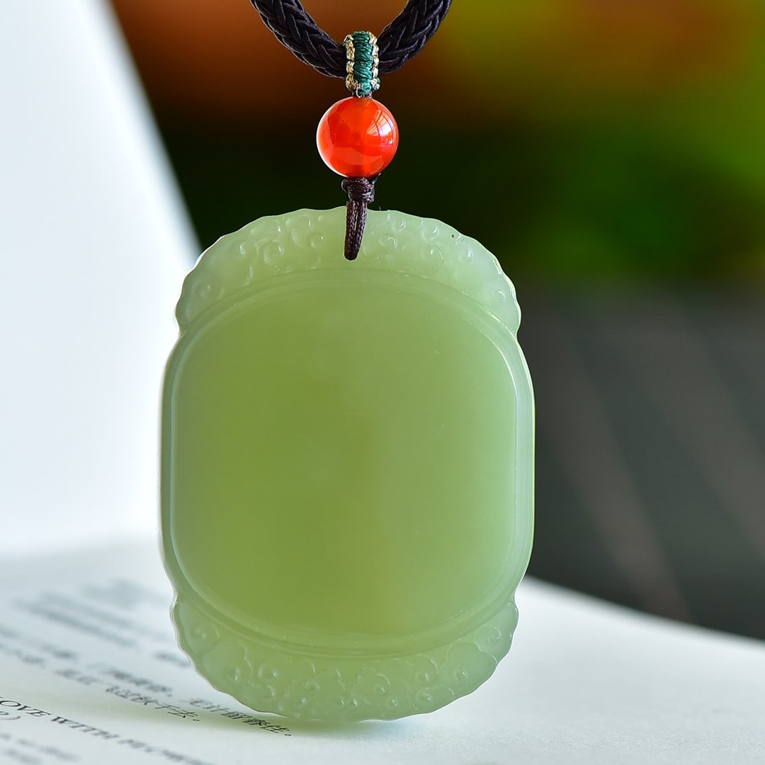 An Exquisite Greenish Jade Pendant (1 of 4)