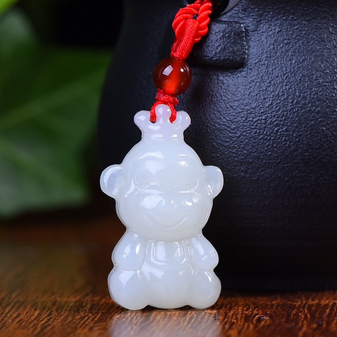 An Exquisite White Jade Monkey Pendant: An Exquisite White Jade Monkey Pendant,Size:1.3inx0.9in 白玉猴挂件