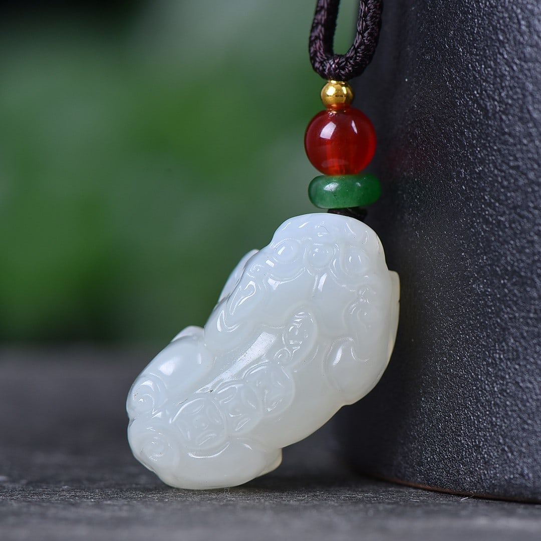 An Exquisite White Jade Wealth-Attracting Creature Pendant: An Exquisite White Jade Wealth-Attracting Creature Pendant,Size:0.6inx1.1in 白玉貔貅挂件