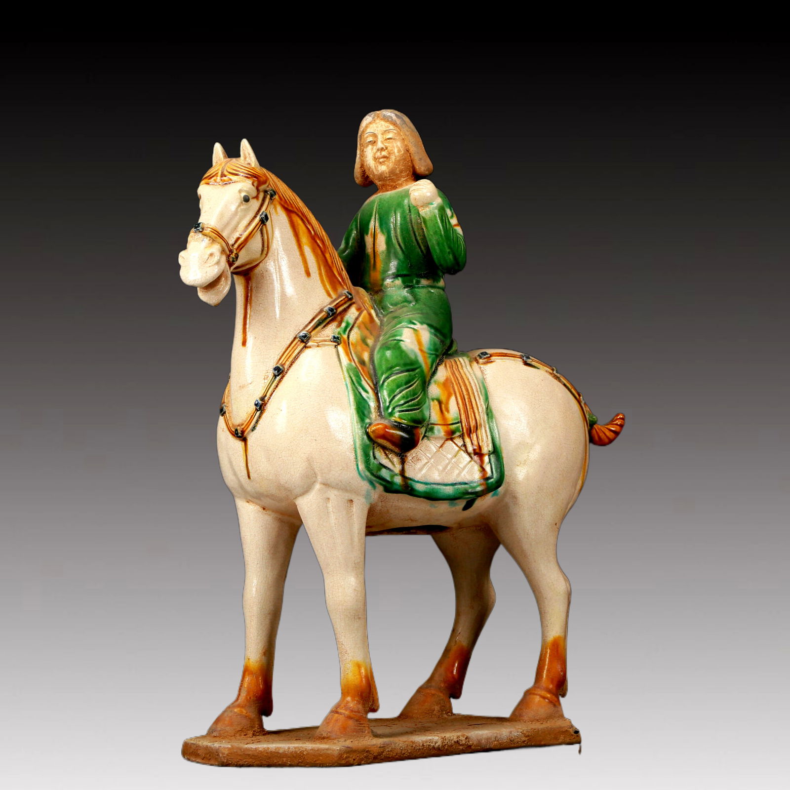 A Rare Tang Tri-Color Glazed Pottery Figure Riding Horse Ornament: A Rare Tang Tri-Color Glazed Pottery Figure Riding Horse Ornament,Tang Dynasty, China,Chinese Tang Tri-colored Pottery, or Tang Sancai, flourished during the Tang Dynasty (618–907 AD). It's