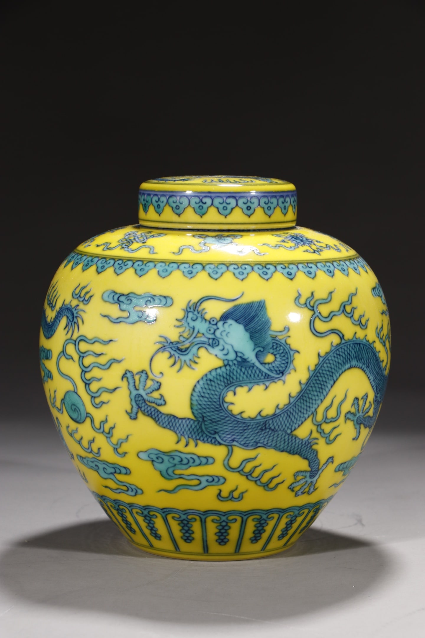 An Exquisite Yellow Ground Doucai Auspicious Cloud and Dragon Pattern Jar with Cover: An Exquisite Yellow Ground Doucai Auspicious Cloud and Dragon Pattern Jar with Cover,Qing Dynasty,China,Yongzheng Six-character Mark,Size:7.7in 