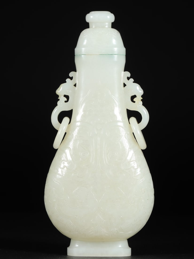 An Exquisite White Jade Chi-Dragon Pattern Phoenix-Ears Bottle: An Exquisite White Jade Chi-Dragon Pattern Phoenix-Ears Bottle ,Qing Dynasty, China,Size:3.5inx1.7inx7.9in,Weight:487g 白玉螭龙纹凤耳盖瓶 ,中