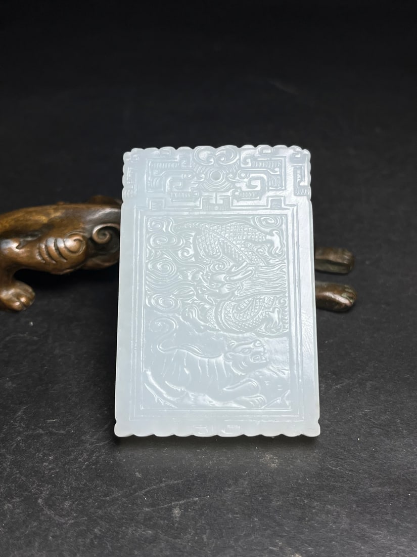 An Exquisite White Jade Dragon Pattern Pendant: An Exquisite White Jade Dragon Pattern Pendant,Qing Dynasty,China,Size:1.5inx0.3inx2.3in,Weight:46g 白玉龙纹挂件,中国清代
