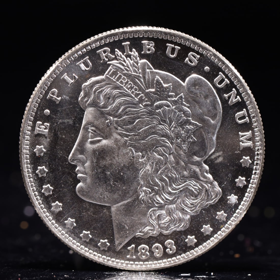 USA Morgan Dollar 1893 Coin: Obv: profile bust with date below and E PLURIBUS UNUM legend and stars around. Rev: eagle with In God we trust above within wreath with UNITED STATES OF AMERICA ONE DOLLAR legend. IN GOD WE TRUST / LI