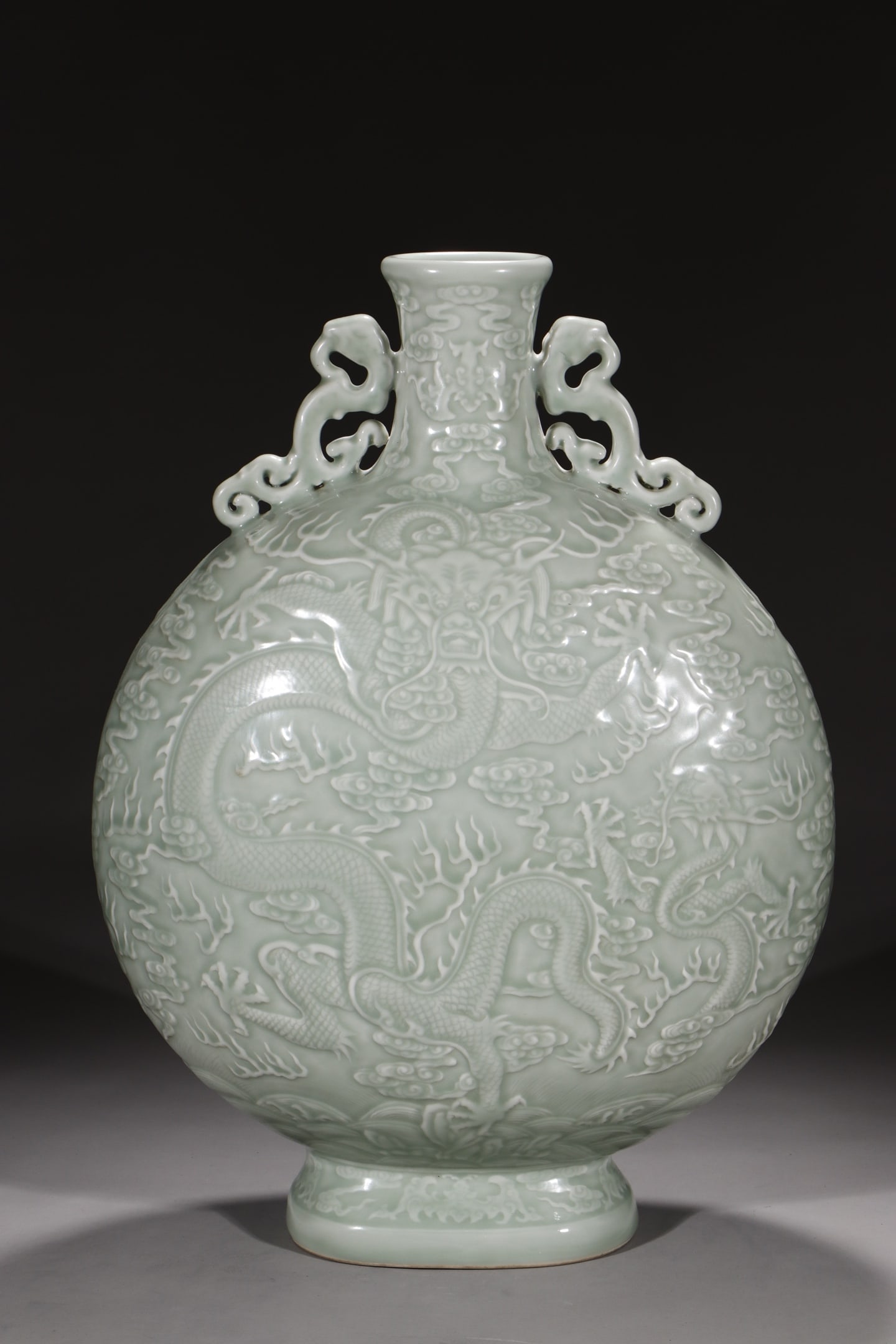 An Exquisite Celadon Glazed Auspicious Cloud and Dragon Pattern Double-Ears Vase (1 of 9)