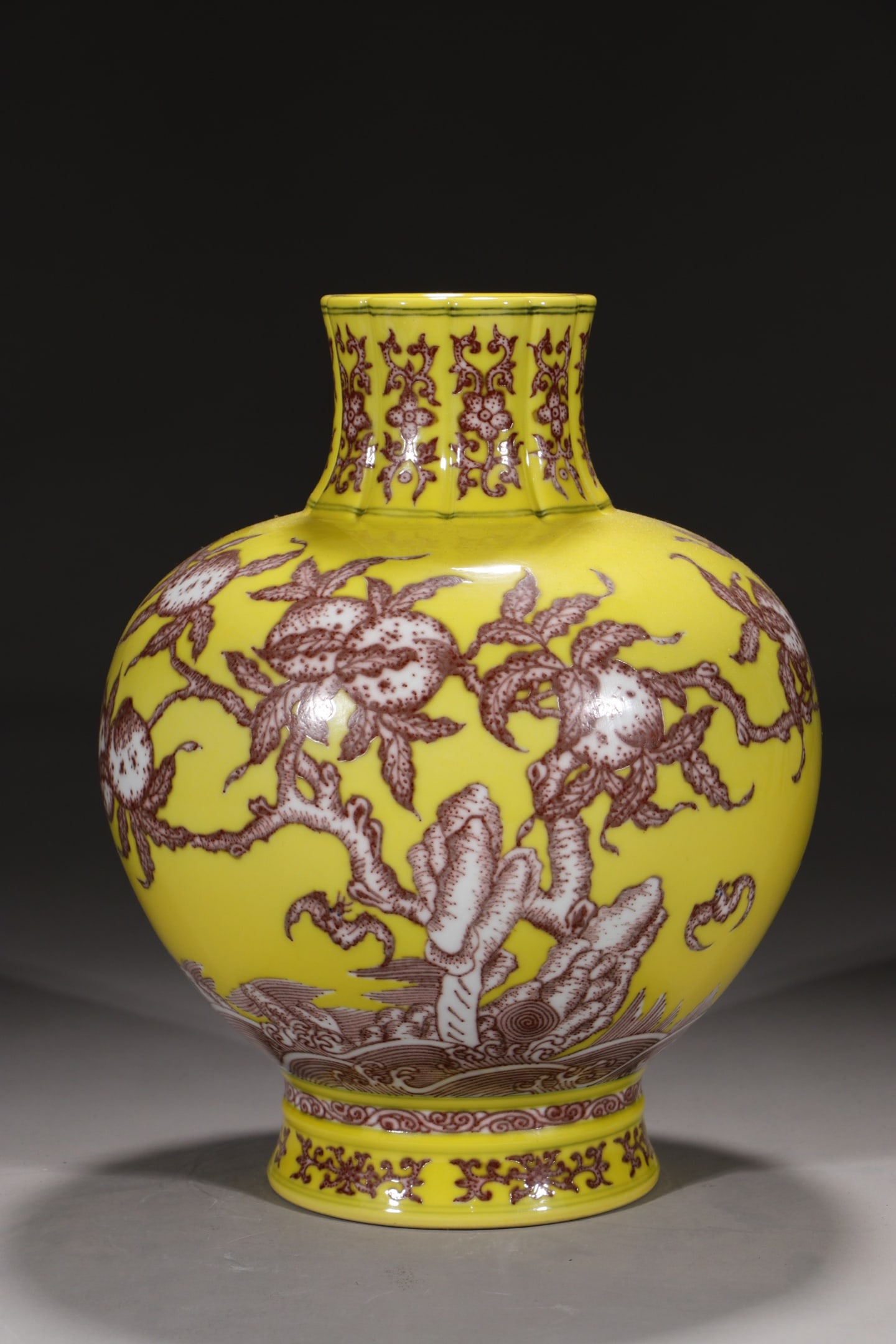 An Exquisite Yellow Ground Underglaze-Red Bats and Peach Pattern Vase: An Exquisite Yellow Ground Underglaze-Red Bats and Peach Pattern Vase,Qing Dynasty,China,Qianlong Six-character Mark,Size:10.9in 