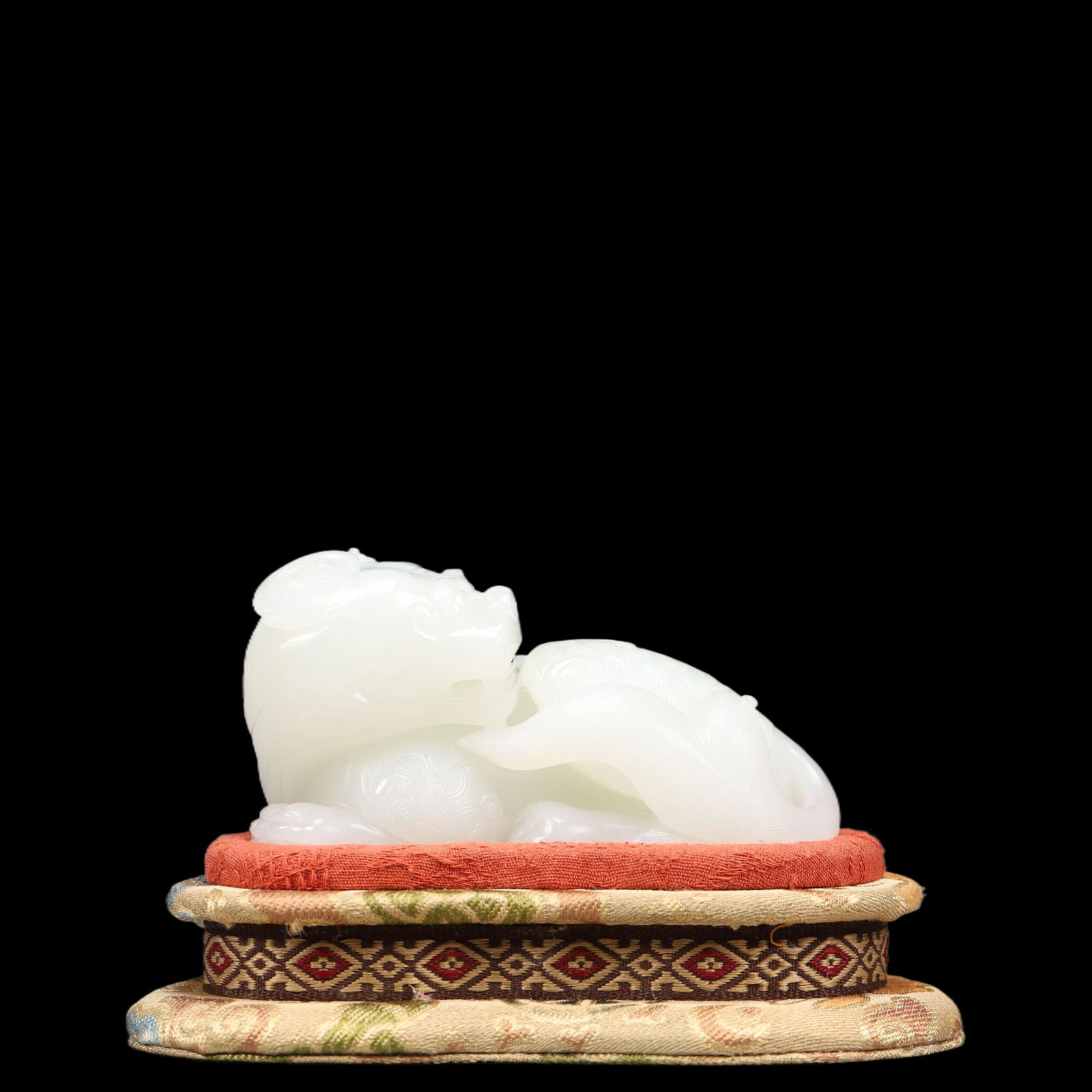 An Exquisite White Jade Lion Ornament,With Base: An Exquisite White Jade Lion Ornament,With Base, Qing Dynasty, China, Qianlong Four-character Mark, Size:3.3inx1.6inx1.8in, Weight:251g 