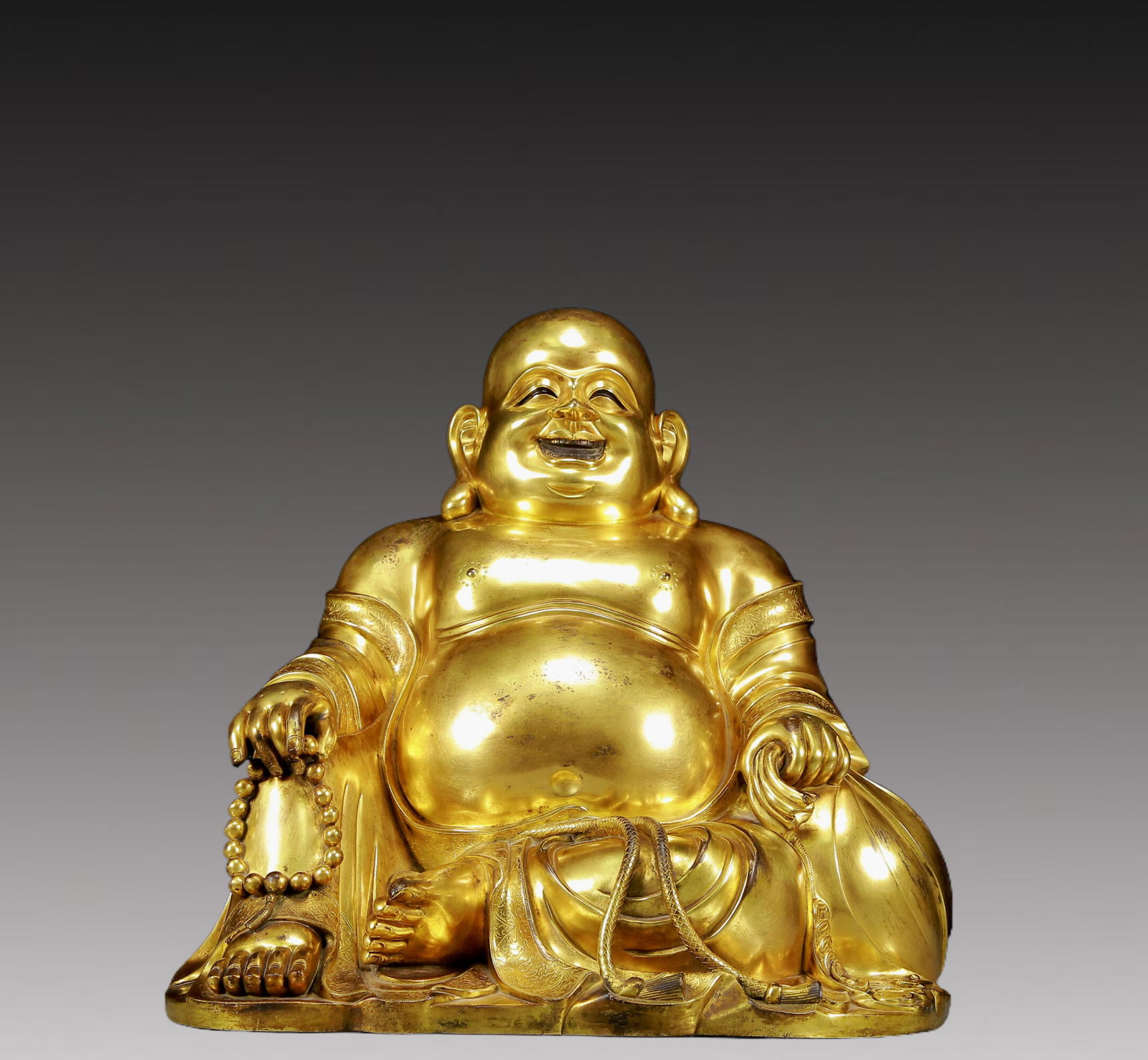A Solemn Gilt Bronze Statue of Maitreya Buddha: A Solemn Gilt Bronze Statue of Maitreya Buddha,Ming Dynasty, China,Size:16.5inx11.8inx16.5in,Weight:59.40kg 铜鎏金弥勒佛像，明代