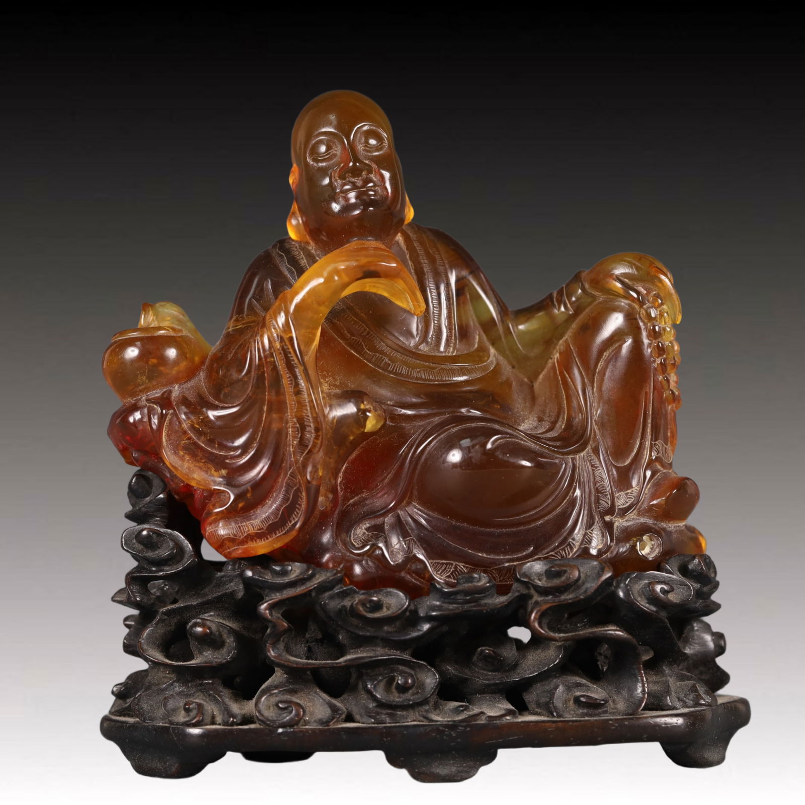 A Precious Amber Arhat Ornament: A Precious Amber Arhat Ornament,Qing Dynasty, China,Size:2inx3.9inx4.3in Weight:157.9g 琥珀罗汉摆件,中国清代