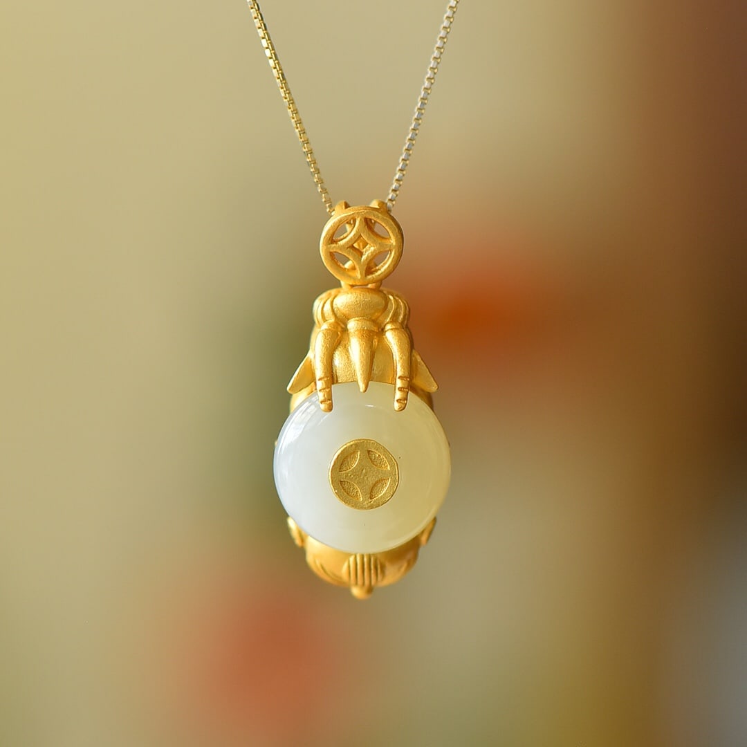 An Exquisite Sterling Silver-Gold Plated Inlaid White Jade Pendant: An Exquisite Sterling Silver-Gold Plated Inlaid White Jade Pendant,Size:0.5inx0.5in 纯银镀金镶白玉吊坠