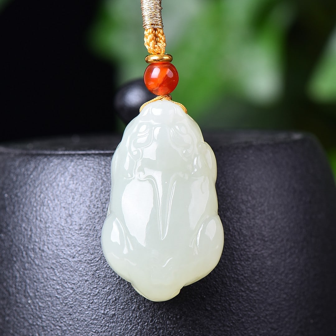 An Exquisite White Jade Wealth-Attracting Creature Pendant: An Exquisite White Jade Wealth-Attracting Creature Pendant,Size:0.9inx1.4in 白玉貔貅挂件