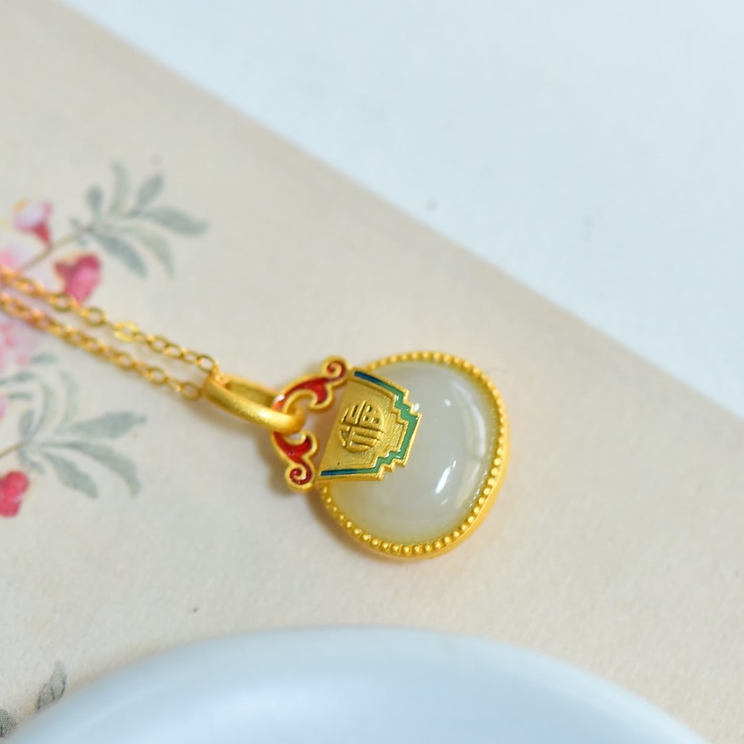 An Exquisite Sterling Silver-Gold Plated Inlaid White Jade Pendant: An Exquisite Sterling Silver-Gold Plated Inlaid White Jade Pendant 纯银镀金镶白玉吊坠