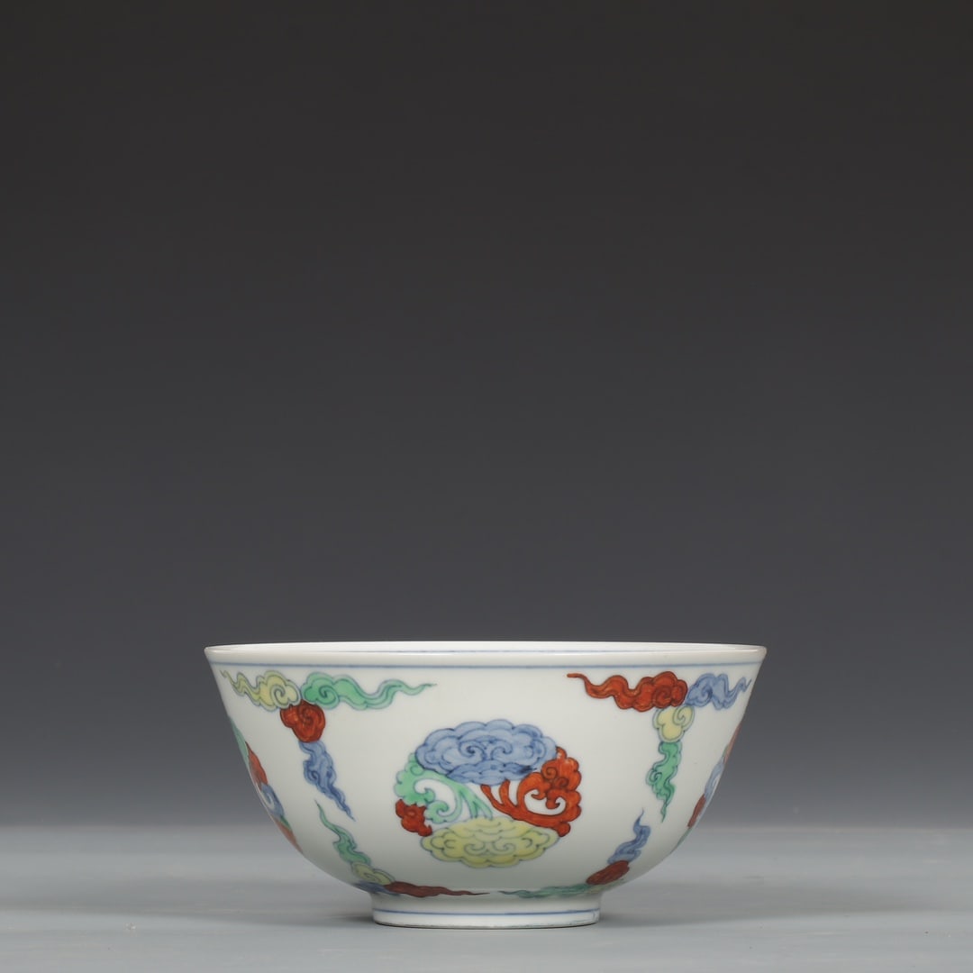 An Exquisite Doucai Auspicious Cloud Pattern Bowl: An Exquisite Doucai Auspicious Cloud Pattern Bowl,Ming Dynasty,China,Chenghua Six-character Mark,Size:2.8inx5.5in 斗彩祥云纹碗,中国明代,