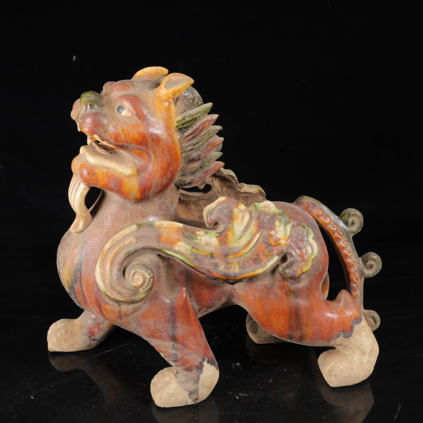 An Exquisite Tang Tri-Color Glazed Pottery Lion Ornament: An Exquisite Tang Tri-Color Glazed Pottery Lion Ornament,Tang Dynasty,China,Size:11.8inx13.4inx5.9in,Weight:1980g 