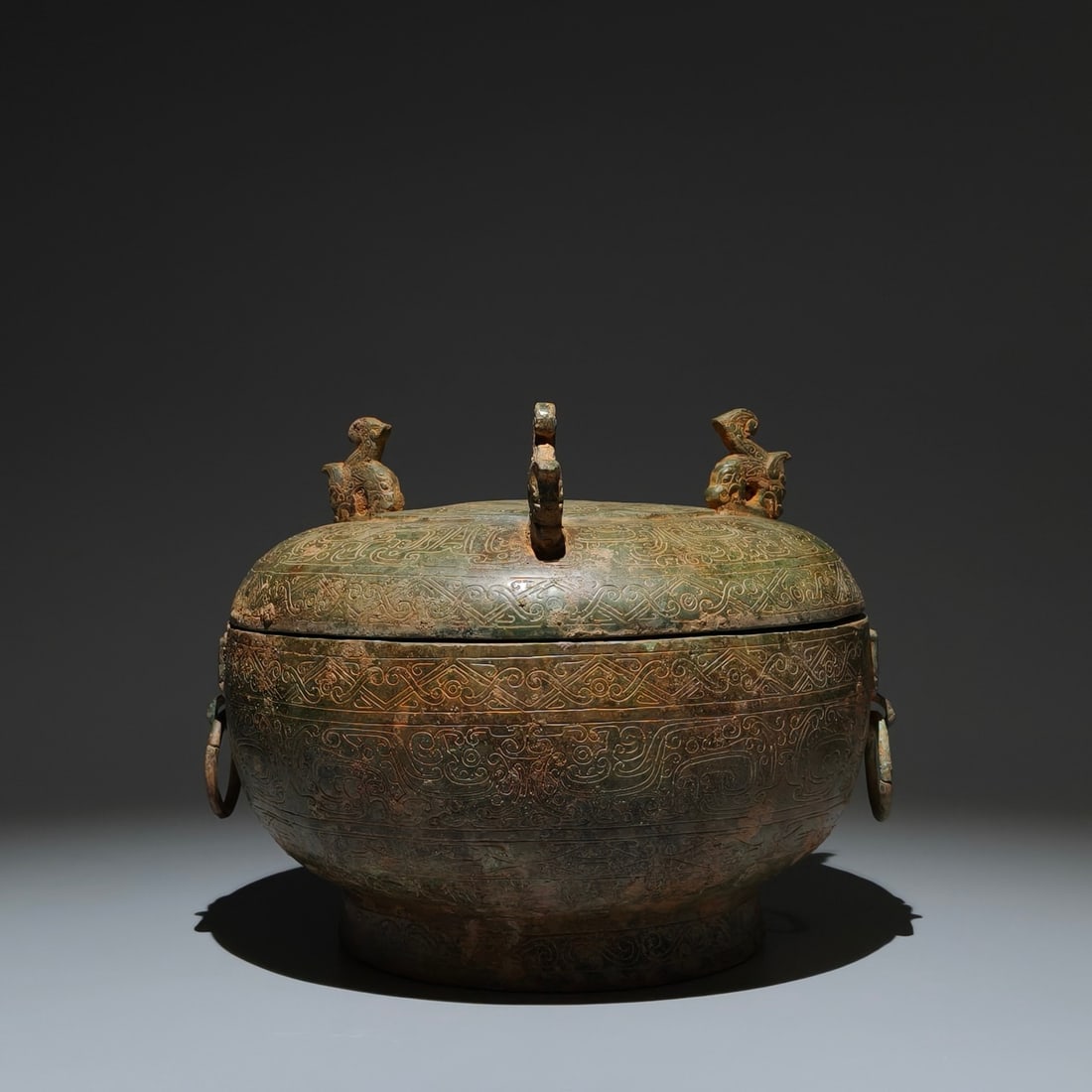An Archaic Bronze Auspicious Cloud Pattern Box: An Archaic Bronze Auspicious Cloud Pattern Box,The Warring States Period in China,Size:8.3inx9.4in 青铜祥云纹盒,中国战国时期
