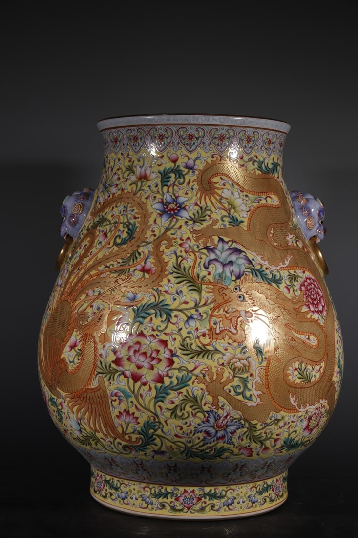 An Exquisite Enamel Yellow Ground Dragon and Phoenix Pattern Lion-Ears Vase: An Exquisite Enamel Yellow Ground Dragon and Phoenix Pattern Lion-Ears Vase,Qing Dynasty,China,Qianlong Four-character Mark,Size:18.5inx9.6in 
