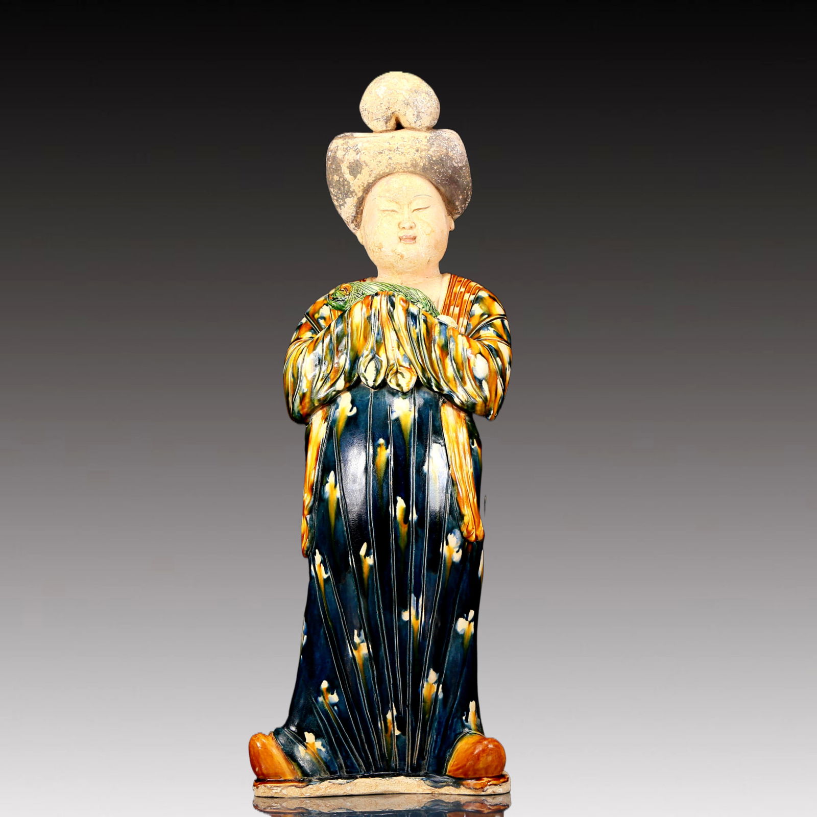 A Rare Tang Tri-Color Glazed Pottery Woman Ornament: A Rare Tang Tri-Color Glazed Pottery Woman Ornament,Tang Dynasty, China,Chinese Tang Tri-colored Pottery, or Tang Sancai, flourished during the Tang Dynasty (618–907 AD). It's renowned for its