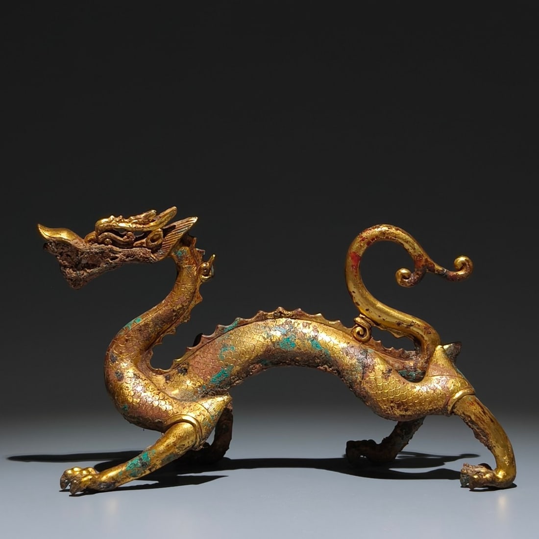 A Rare Gilt Bronze Dragon Ornament: A Rare Gilt Bronze Dragon Ornament,Tang Dynasty, China,Size:5.5inx9.4inx3.5in 铜鎏金龙摆件,中国唐代