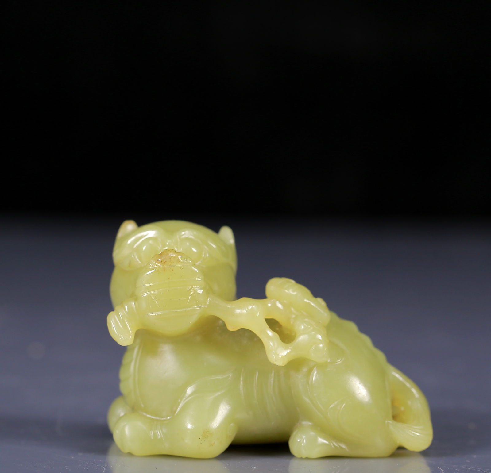 An Exquisite Yellow Jade Auspicious Beast Ornament: An Exquisite Yellow Jade Auspicious Beast Ornament ,Qing Dynasty, China,Size:2.4inx1.4inx1.6in,Weight:110g 黄玉瑞兽摆件，清代