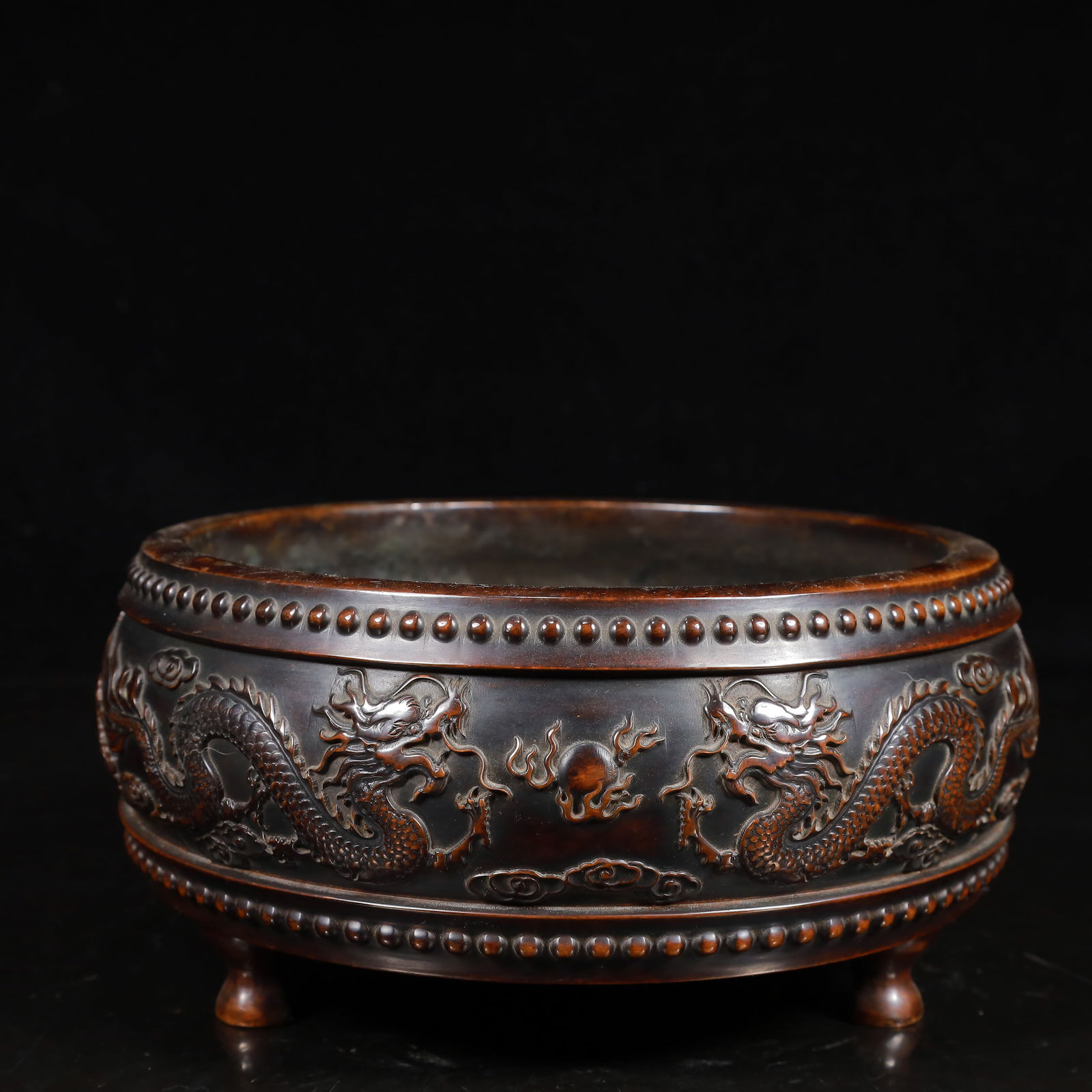 A Rare Bronze Auspicious Cloud and Dragon Pattern Tripod Censer: A Rare Bronze Auspicious Cloud and Dragon Pattern Tripod Censer,Ming Dynasty,China,Xuande Six-character Mark,Size:7.9inx3.9in,Weight:3700g 铜祥云龙纹三足Ɖ