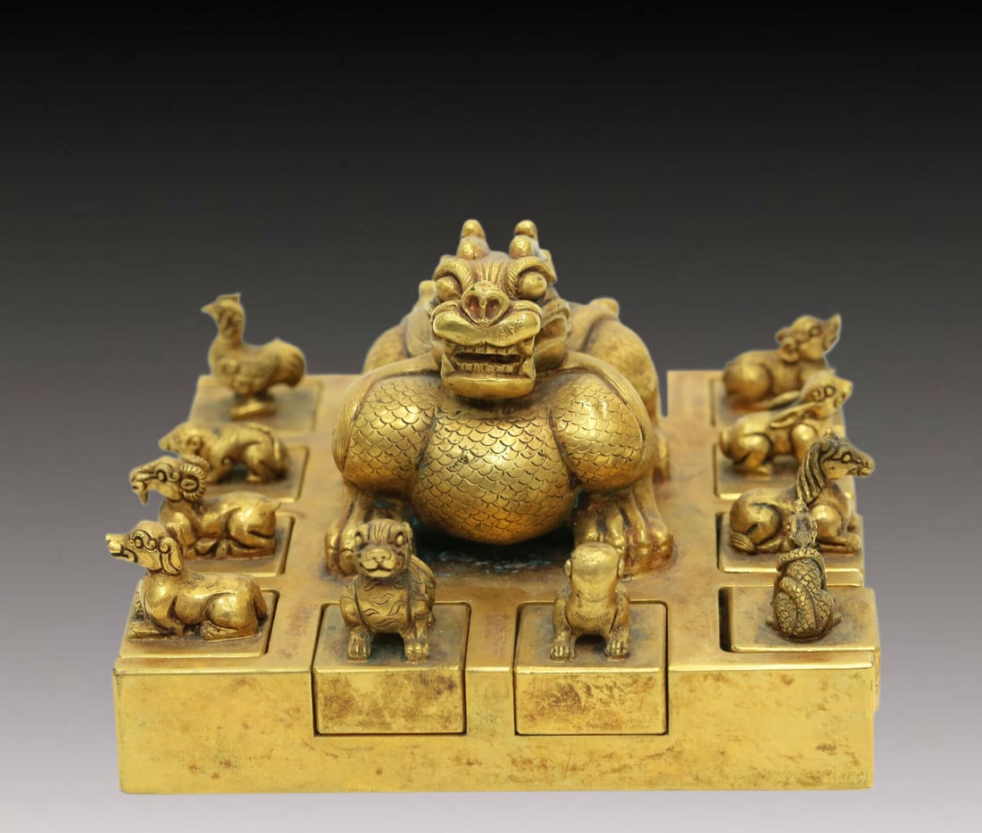 A Brilliant Gilt-Bronze 'Auspicious Beast' Seal: A Brilliant Gilt-Bronze 'Auspicious Beast' Seal. The large beast in the middle is cast with rounded, bulging eyes, and flanked by rows of other recumbent, miniature beasts. Chinese Qing Dynasty.
