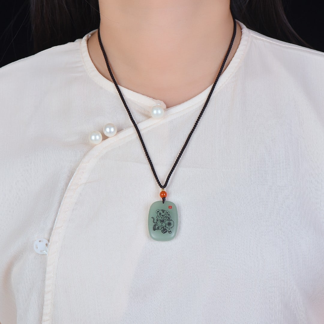 An Exquisite Greenish Jade Tiger Pattern Pendant: An Exquisite Greenish Jade Tiger Pattern Pendant,Size:1inx1.4in 青玉虎纹挂件