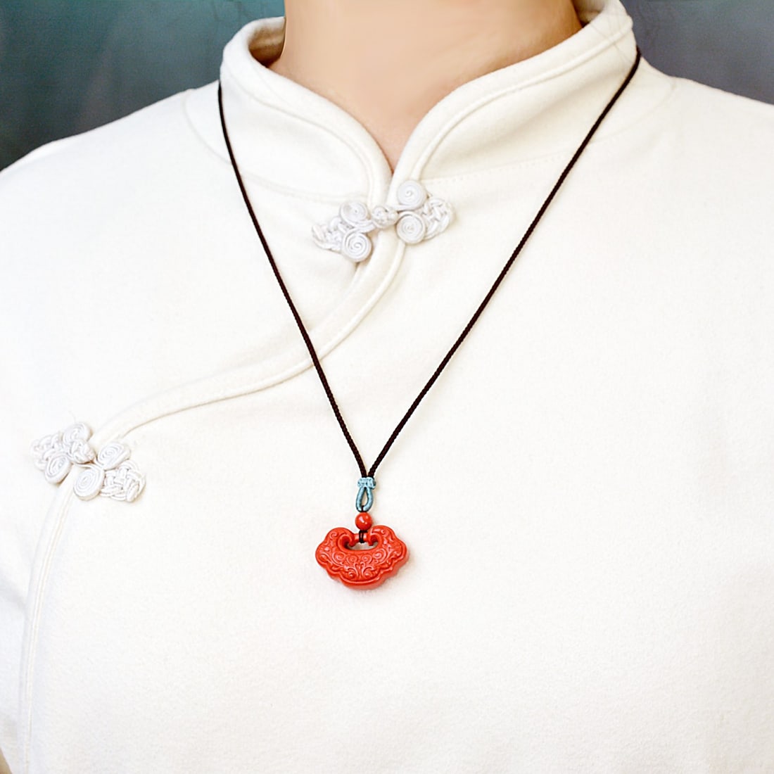 An Exquisite Cinnabar Flower Pattern Pendant (1 of 6)