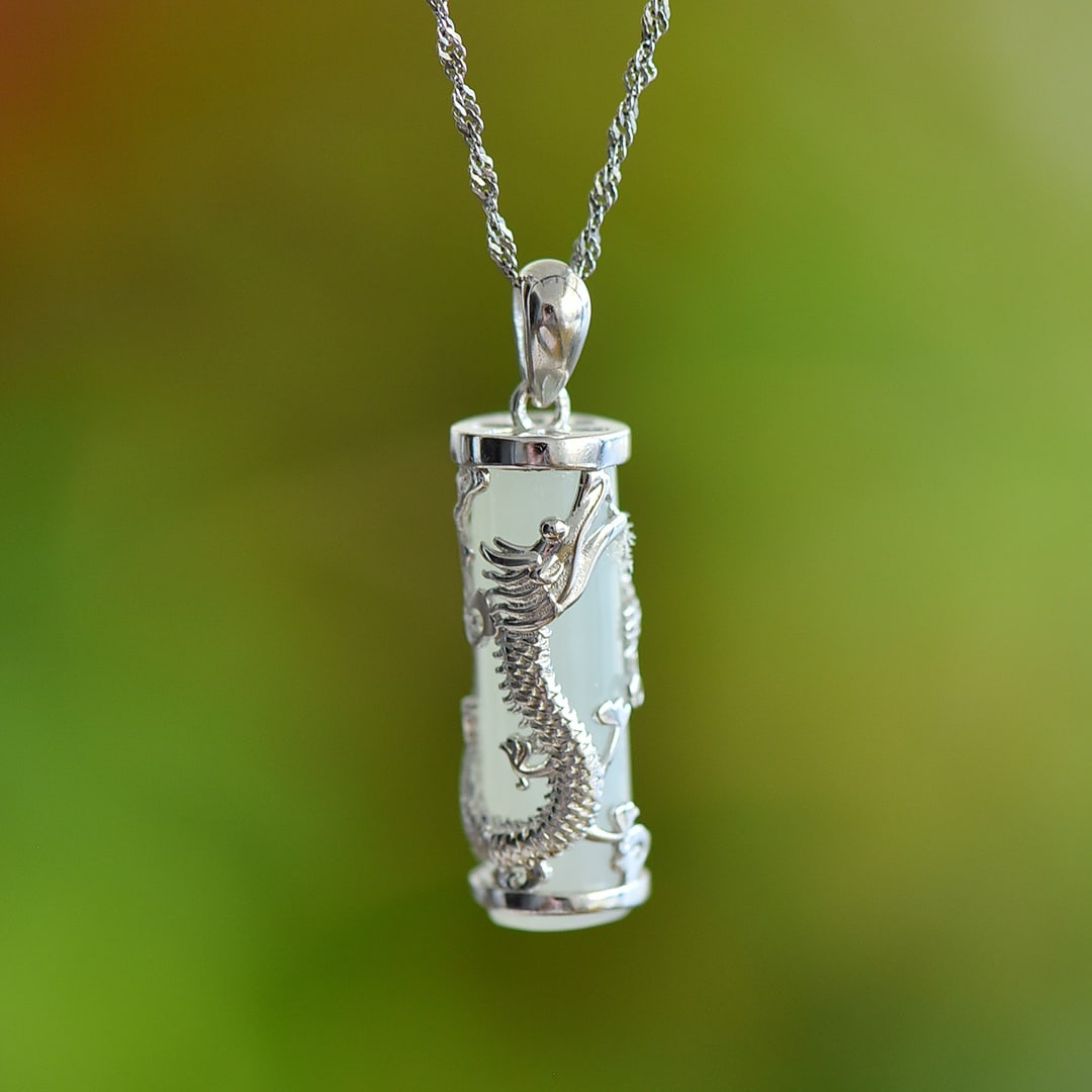 An Exquisite Sterling Silver Inlaid White Jade Pendant: An Exquisite Sterling Silver Inlaid White Jade Pendant,Size:0.3inx0.9in 纯银镶白玉吊坠