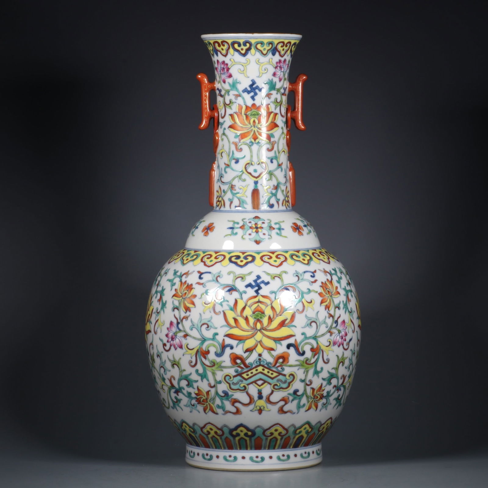 An Exquisite Doucai Lotus Pattern Double-Ears Vase: An Exquisite Doucai Lotus Pattern Double-Ears Vase,Qing Dynasty,China,Qianlong Six-character Mark,Size:13.9inx3.1in 斗彩缠枝莲纹双耳瓶,中