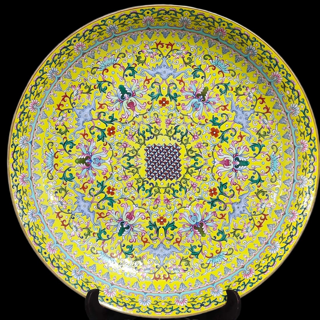 An Exquisite Yellow Ground Famille-Rose Lotus Pattern Plate: An Exquisite Yellow Ground Famille-Rose Lotus Pattern Plate,Qing Dynasty,China,Qianlong Six-character Mark,Size:3.8inx20.1in 黄地粉彩缠枝莲纹盘