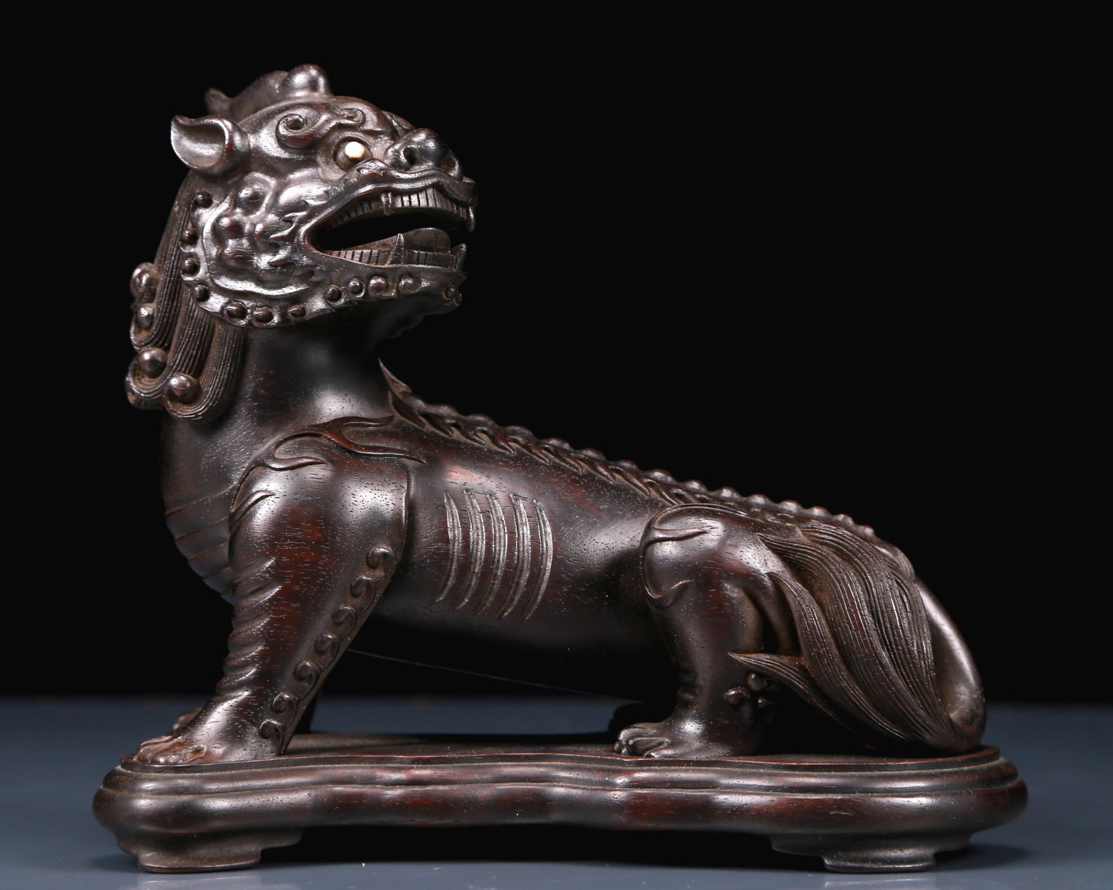 An Exquisite Zitanwood Auspicious Beast Ornament: An Exquisite Zitanwood Auspicious Beast Ornament,Qing Dynasty, China,Size:6.3inx3.5inx5.9in,Weight:465g 紫檀木瑞兽摆件，清代