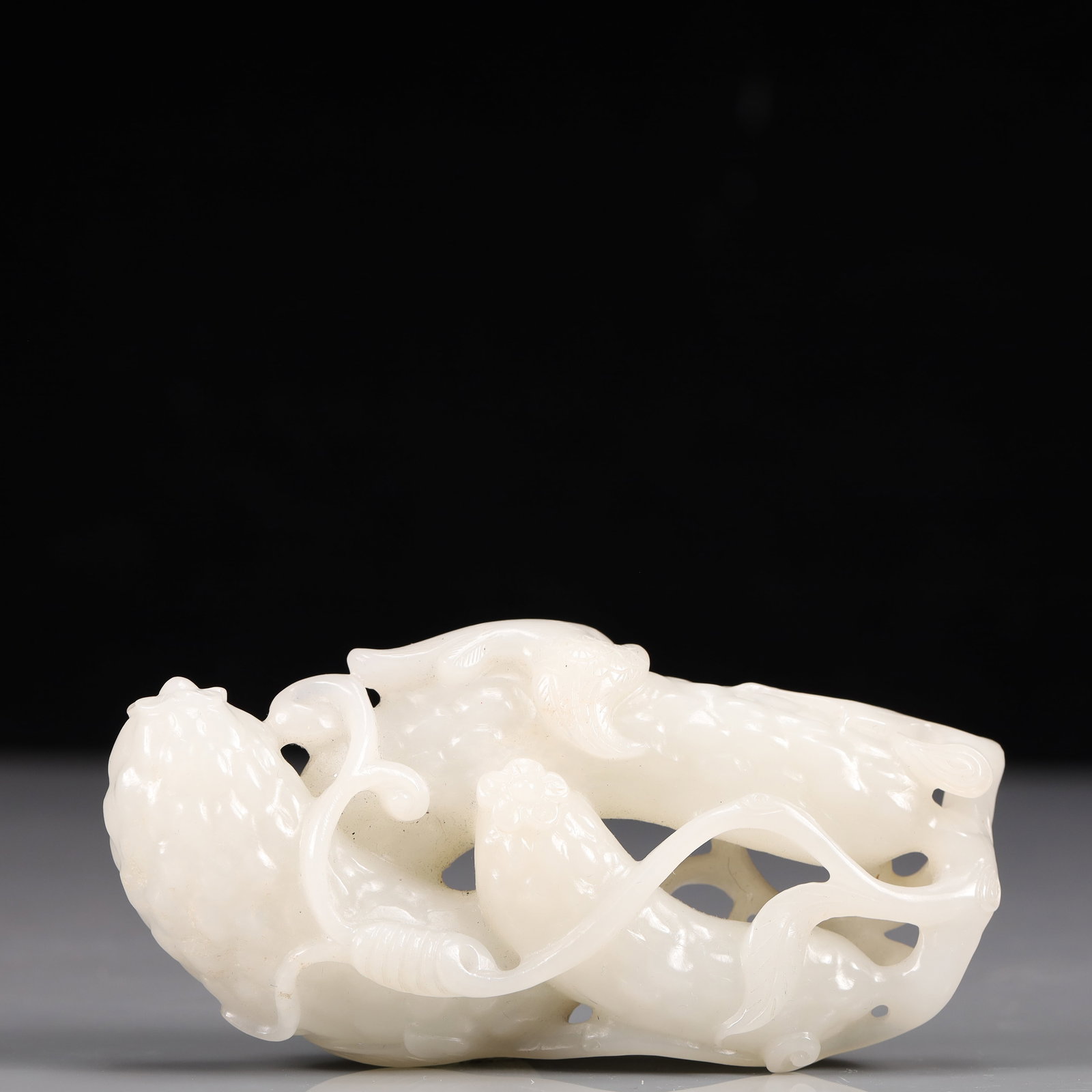 An Exquisite White Jade Balsam Pear-Shaped Ornament: An Exquisite White Jade Balsam Pear-Shaped Ornament, Qing Dynasty, China, Size:4.7inx2.4inx1in, Weight:263g 精美的白玉苦瓜形摆件,中